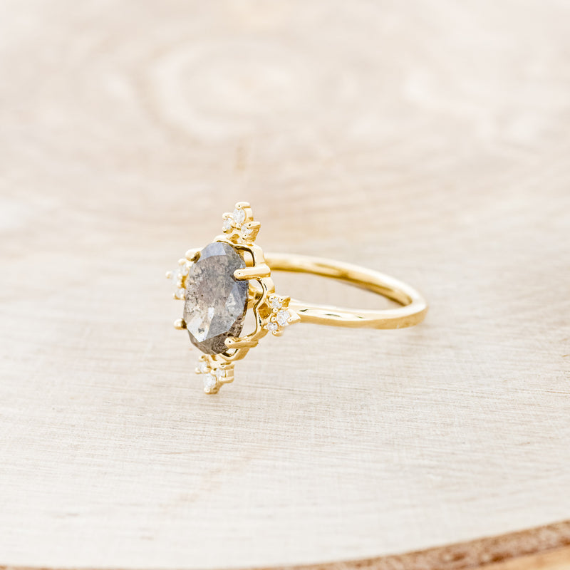 Shown here is "Treva", a women's engagement ring with diamond accents displayed here with an oval salt & pepper diamond but listed here as a mounting-only option, facing left. Follow the instructions above to select your stone.
