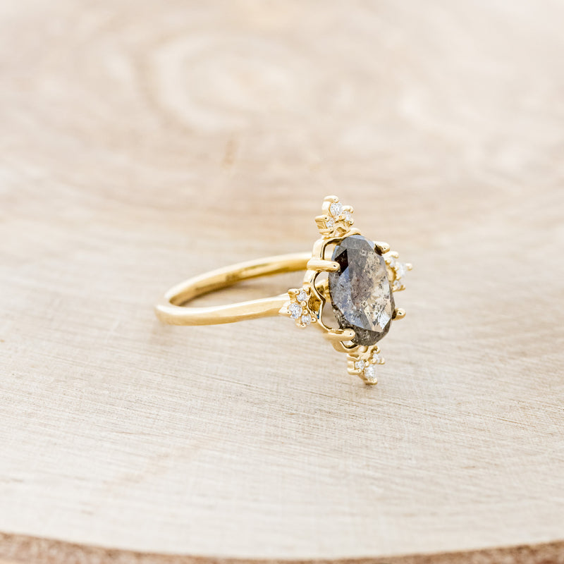 Shown here is "Treva", a women's engagement ring with diamond accents displayed here with an oval salt & pepper diamond but listed here as a mounting-only option, facing right. Follow the instructions above to select your stone.