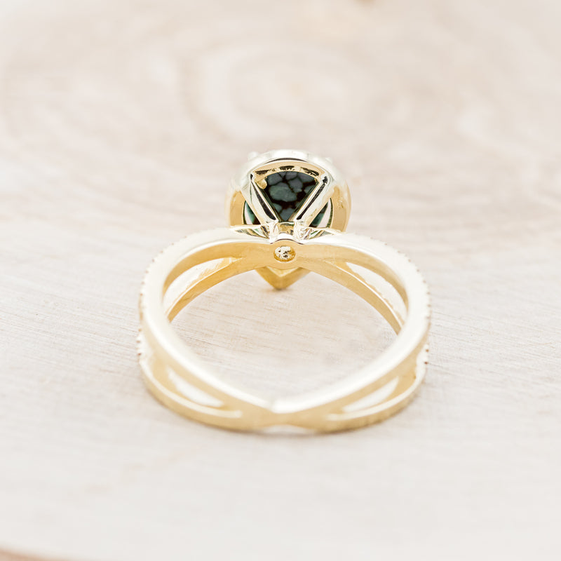 Shown here is "Nala", a split shank-style turquoise women's engagement ring with a diamond halo and diamond accents, back view. Many other center stone options are available upon request.