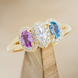 "MERCILLA" - THREE STONE OVAL ENGAGEMENT RING WITH PINK TOURMALINE, MOISSANITE & TOPAZ-1