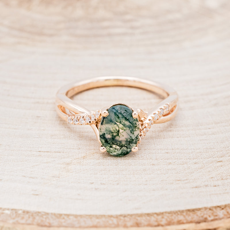 Shown here is "Roslyn", an oval moss agate women's engagement ring with diamond accents, front facing. Many other center stone options are available upon request.