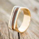 Shown here is "Mesa", a custom, handcrafted men's wedding band featuring elk antler, turquoise, and ironwood inlays with one offset diamond, upright facing left. Additional inlay options are available upon request.