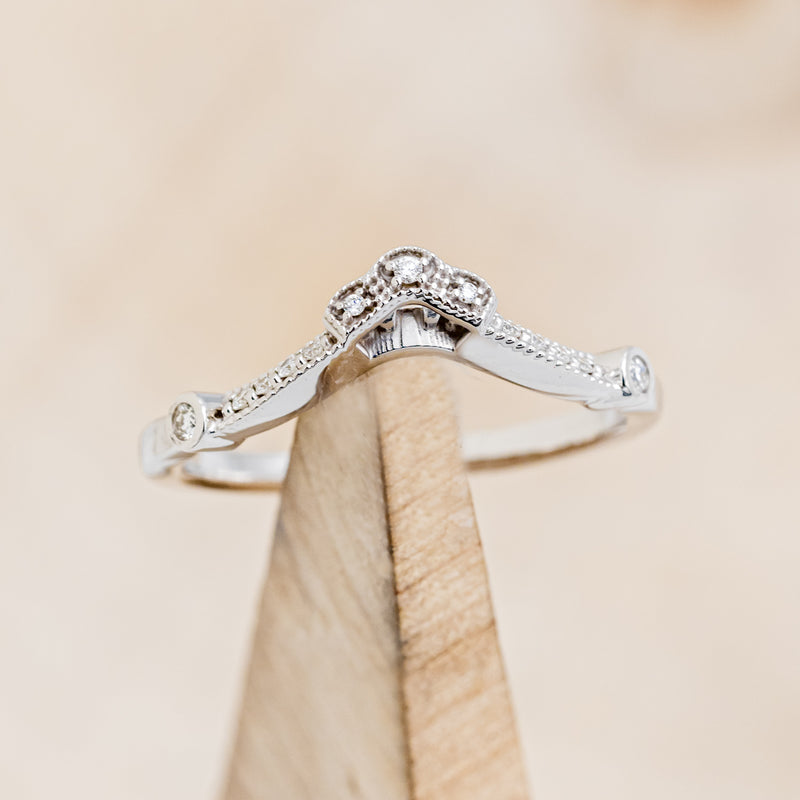 Shown here is "Eileen" tracer, a vintage-style diamond accent band, on stand front facing. Many other center stone options are available upon request.