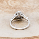 Shown here is "Eileen", a vintage-style moissanite women's engagement ring with a diamond halo, accents, back view. Many other center stone options are available upon request.