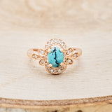 Shown here is "Nora", a vintage-style turquoise women's engagement ring with diamond accents, front facing. Many other center stone options are available upon request.