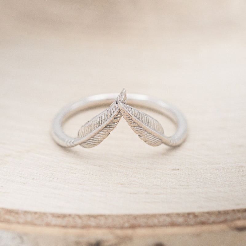 Shown here is "Fala", a feather-style tracer wedding band that is made to go with some of our engagement rings, front facing (email for options).