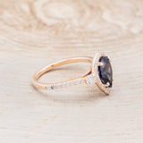 Shown here is "KB", a lab-created alexandrite women's engagement ring with diamond halo & accents, facing right. Many other center stone options are available upon request.