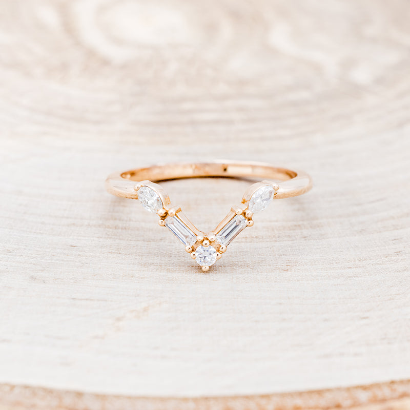 Shown here is "Melody", a 14K gold v-shaped band with diamond accents, front facing.