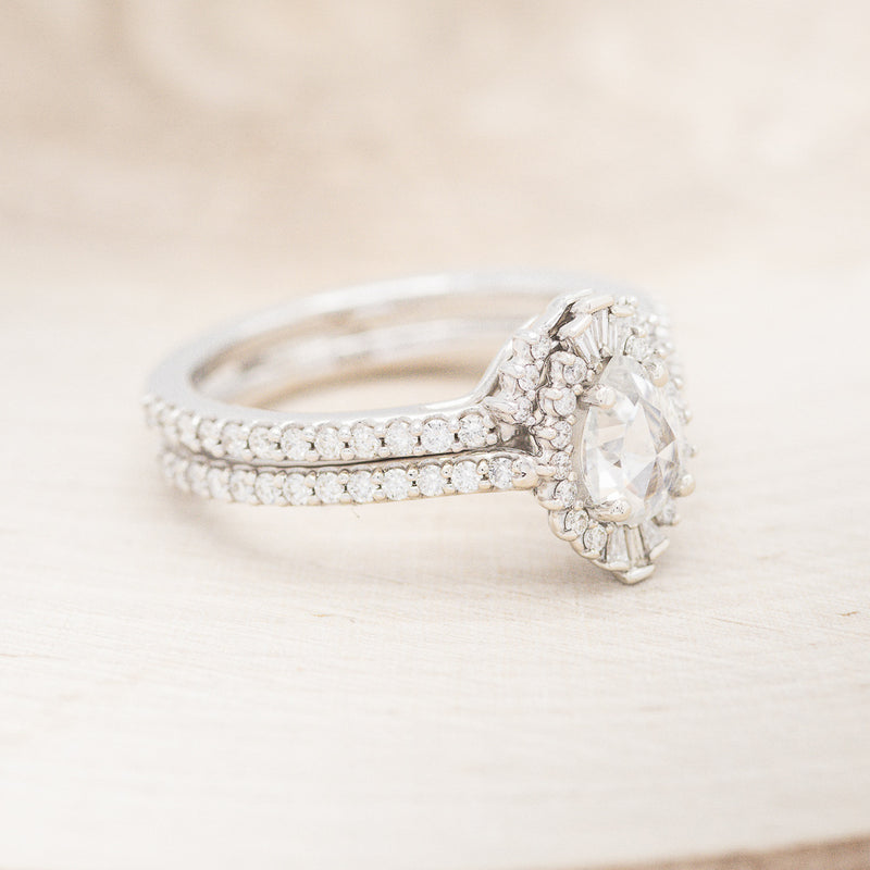 "THEIA" - PEAR-SHAPED MOISSANITE ENGAGEMENT RING WITH DIAMOND TRACER