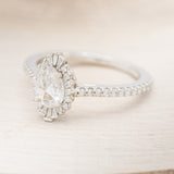 "THEIA" - PEAR-SHAPED MOISSANITE ENGAGEMENT RING WITH DIAMOND TRACER