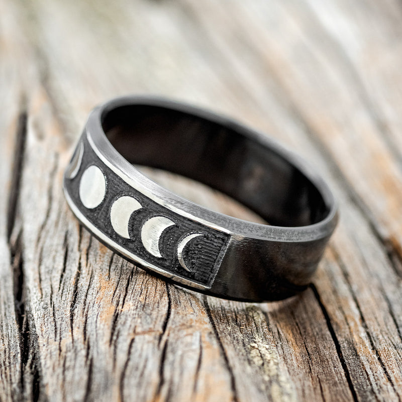 "LUCIAN" - CUSTOM EMBOSSED MOON PHASE WEDDING RING FEATURING A BLACK ZIRCONIUM BAND