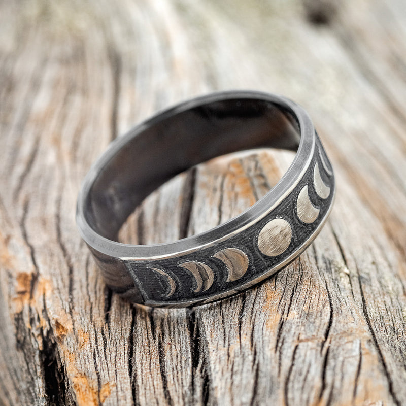 "LUCIAN" - CUSTOM EMBOSSED MOON PHASE WEDDING RING FEATURING A BLACK ZIRCONIUM BAND