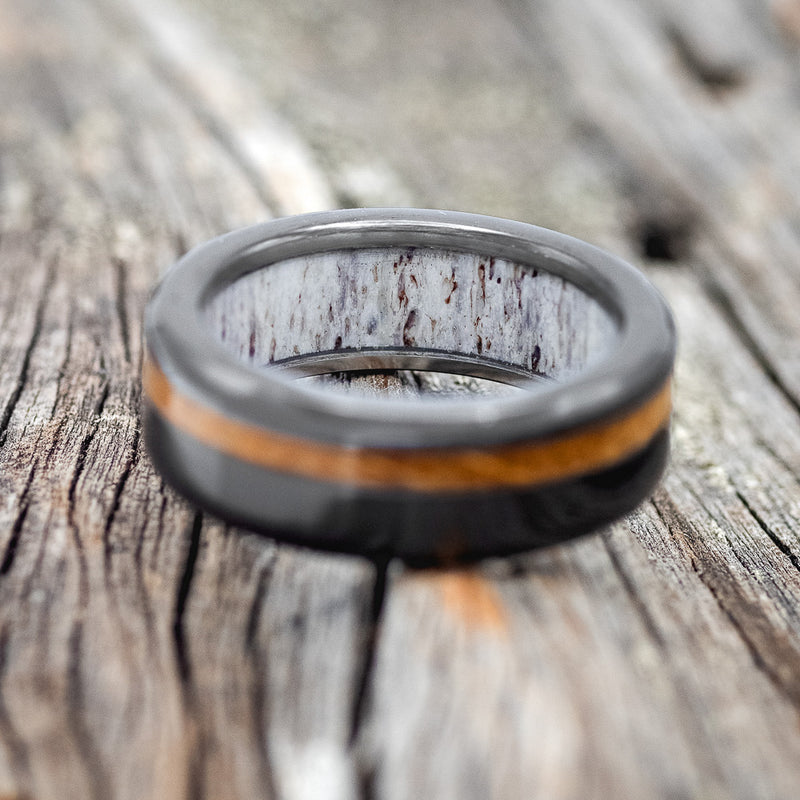 "VERTIGO" - WHISKEY BARREL OAK WEDDING RING FEATURING AN ANTLER LINED BLACK ZIRCONIUM BAND