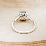 "GAIA" - EMERALD CUT MEDEINA GREEN MOISSANITE ENGAGEMENT RING WITH DIAMOND ACCENTS