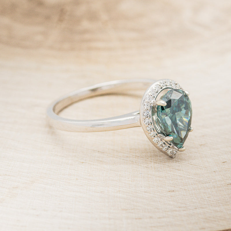 "CLARISS" - PEAR-SHAPED MEDEINA GREEN MOISSANITE ENGAGEMENT RING WITH DIAMOND HALO
