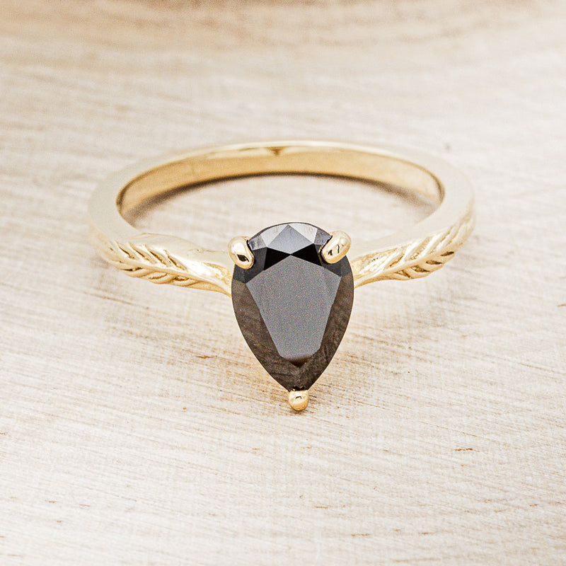 "HOPE" - PEAR-SHAPED MIDNIGHT BLACK MOISSANITE SOLITAIRE ENGAGEMENT RING WITH FEATHER ACCENTS