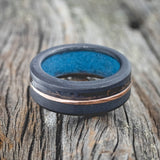 "CASTOR" - PATINA COPPER & 14K GOLD INLAY WEDDING BAND FEATURING A SANDBLASTED BLACK ZIRCONIUM BAND WITH TURQUOISE LINING