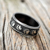 "LEGACY" - CHANNEL EMBOSSED BEAR PAWS WEDDING RING FEATURING A BLACK ZIRCONIUM BAND