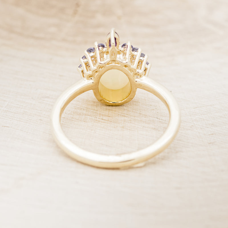 Shown here is "Rapunzel", an oval opal women's engagement ring with amethyst and tanzanite accents, back view. Many other center stone options are available upon request.