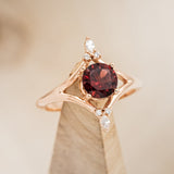 "CALLIE" - ROUND CUT GARNET ENGAGEMENT RING WITH DIAMOND ACCENTS