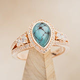 Shown here is "Sofia", a split shank-style turquoise women's engagement ring with delicate and ornate details and is available with many center stone options.