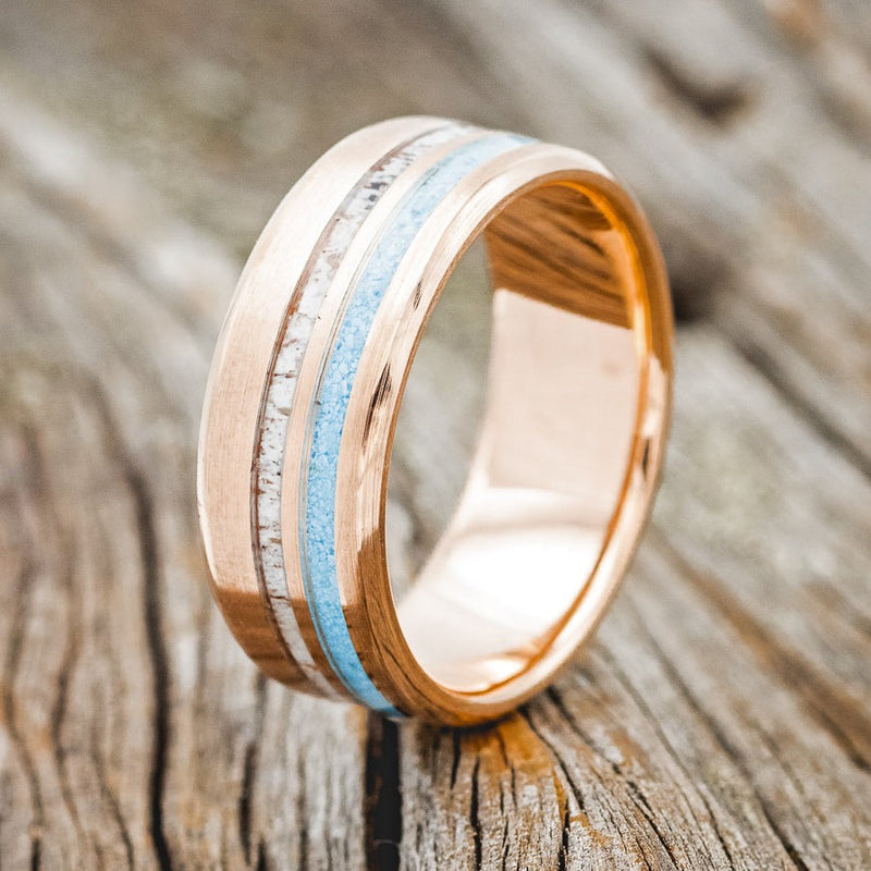 Shown here is "Cosmo", a custom, handcrafted brushed men's wedding ring featuring two offset inlays of turquoise and antler, upright facing left. Additional inlay options are available upon request.