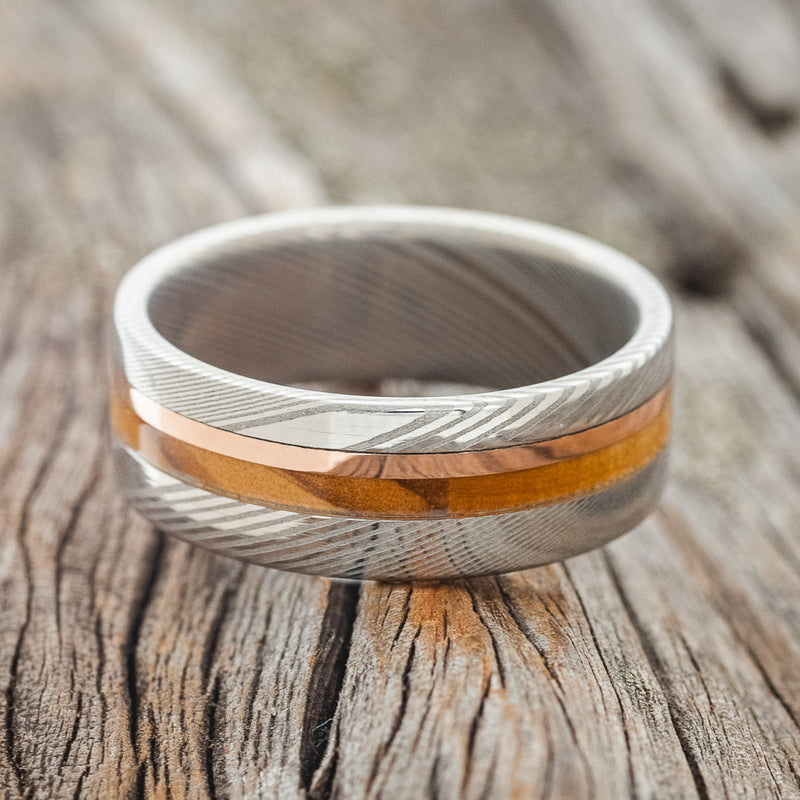 WHISKEY BARREL OAK & 14K GOLD INLAY WEDDING RING FEATURING A DAMASCUS STEEL BAND
