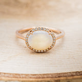 "GALE" - OVAL OPAL ENGAGEMENT RING WITH DIAMOND HALO