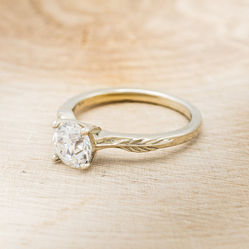 "HOPE" - ROUND MOISSANITE SOLITAIRE ENGAGEMENT RING WITH FEATHER ACCENT DETAILS - READY TO SHIP