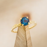 "HOPE" - ROUND CUT LAB-GROWN ALEXANDRITE SOLITAIRE ENGAGEMENT RING WITH FEATHER ACCENTS-8