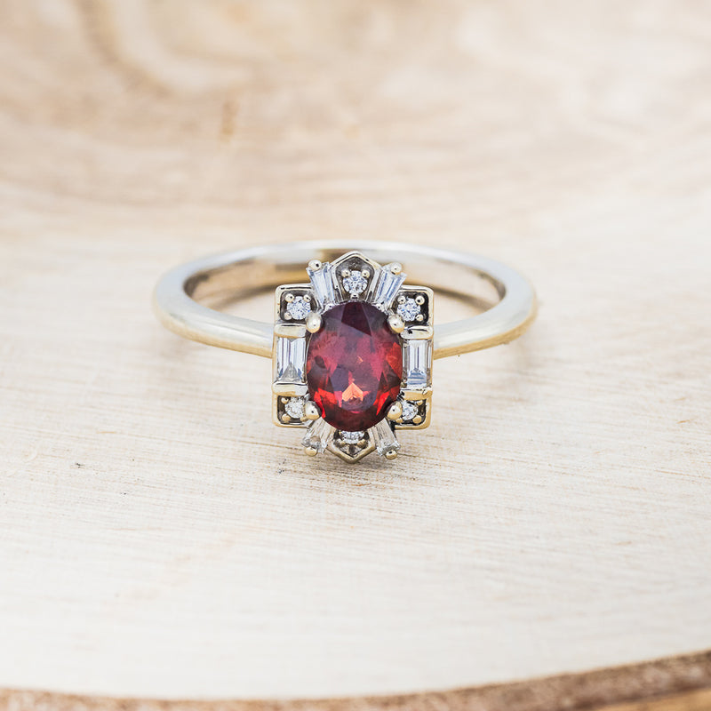 Shown here is "Cleopatra", an art deco-style oval garnet women's engagement ring with diamond accents, front facing. Many other center stone options are available upon request.