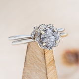 Shown here is "Jane", a salt and pepper diamond women's engagement ring with a floral diamond halo and diamond tracer. Many other center stone options are available upon request.