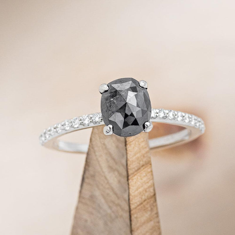 Shown here is "Ramona", a salt & pepper diamond women's engagement ring with diamond accents, on stand front facing. Many other center stone options are available upon request.