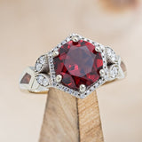 Shown here is The "Lucy in the Sky", a halo-style garnet women's engagement ring with diamond accents and red opal inlays. Many other center stone and inlay options are available upon request.