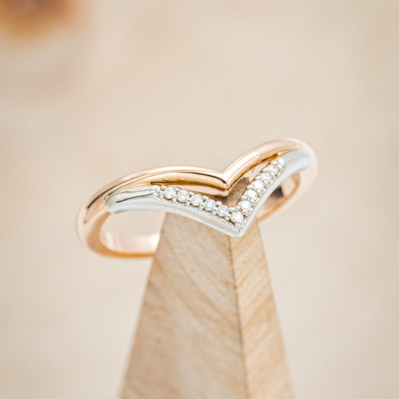 Shown here is "Valarie",  a contoured-style custom, handcrafted women's stackable wedding ring featuring diamond accents, on stand front facing.  Additional stone options are available upon request.