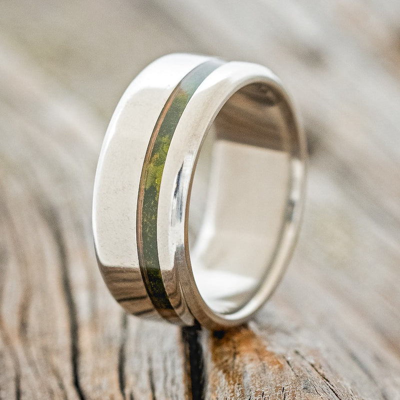 Shown here is "Vertigo", a custom, handcrafted men's wedding ring featuring an offset mossy patina copper inlay, design shown facing right. Additional inlay options are available upon request.