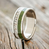 Shown here is "Dyad",  a custom, handcrafted men's wedding ring featuring 2 channels with moss and antler inlays, design shown facing right.  Additional inlay options are available upon request.