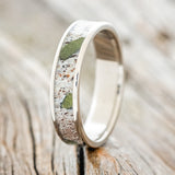 Shown here is "Rainier", a custom, handcrafted men's wedding ring featuring an antler and moss inlay on a titanium band, design shown facing right.  Additional inlay options are available upon request.