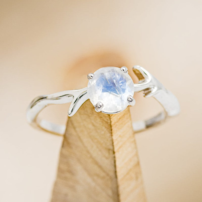 Shown here is "Artemis", an antler/branch-style round cut moonstone women's engagement ring, on stand front facing. Many other center stone options are available upon request. 