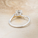 Shown here is "Artemis", a moissanite women's engagement ring with an antler/branch style band, back view. Many other center stone options are available upon request.