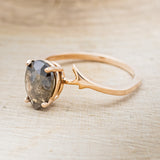 Shown here is "Artemis", a women's engagement ring with an antler-style band displayed here with a pear-shaped salt and pepper diamond but listed here as a mounting-only option, facing left. Follow the instructions above to select your stone.