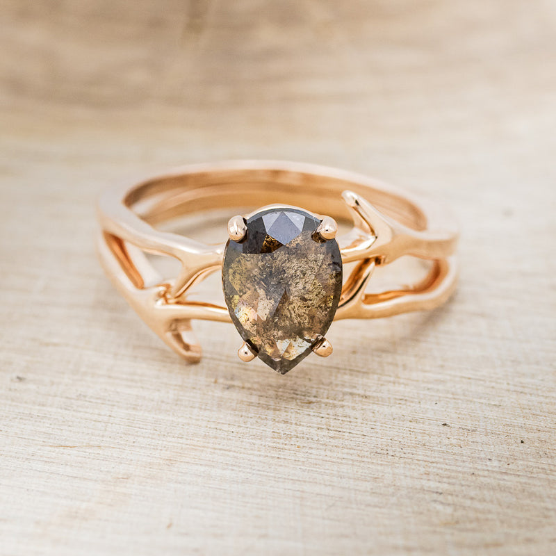 Shown here is "Artemis", a women's engagement ring with an antler-style stacking band displayed here with a pear-shaped salt and pepper diamond but listed here as a mounting-only option, front facing. Follow the instructions above to select your stone.