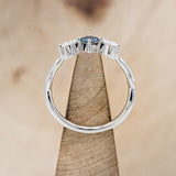 Shown here is "Artemis", an antler/branch-style lab-created alexandrite women's engagement ring with marquise diamond accents, side view on stand. Many other center stone options are available upon request.