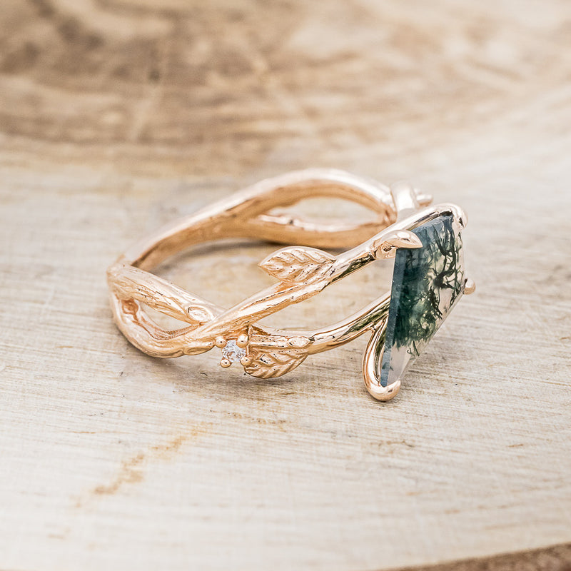 Shown here is "Artemis on the Vine", a branch-style moss agate women's engagement ring with diamond and leaf accents, facing right. Many other center stone options are available upon request.