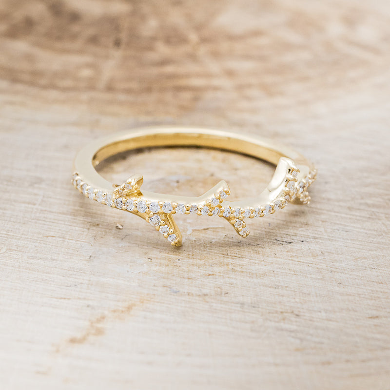 Shown here is "Artemis", a stacking ring with pavé diamonds and an antler/branch style band, front facing. Additional stone options are available upon request.
