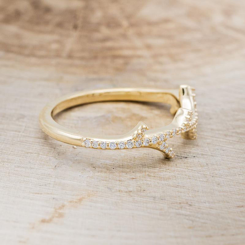 Shown here is "Artemis", a stacking ring with pavé diamonds and an antler/branch style band, facing right. Additional stone options are available upon request.