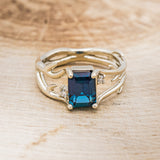 Shown here is "Artemis", an antler/branch-style lab-created alexandrite women's engagement ring with diamond accents, front facing. Many other center stone options are available upon request.