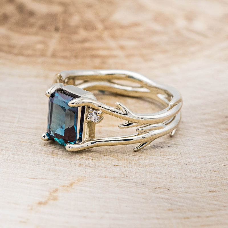 Shown here is "Artemis", an antler/branch-style lab-created alexandrite women's engagement ring with diamond accents, facing left. Many other center stone options are available upon request.