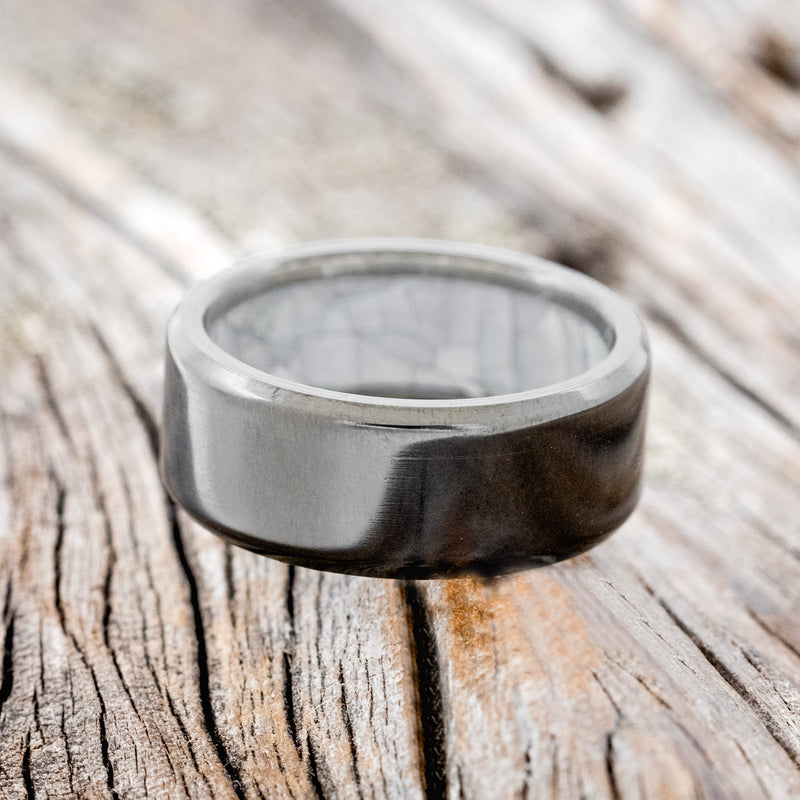 MOTHER OF PEARL LINED WEDDING RING FEATURING A BLACK ZIRCONIUM BAND
