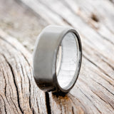 MOTHER OF PEARL LINED WEDDING RING FEATURING A BLACK ZIRCONIUM BAND